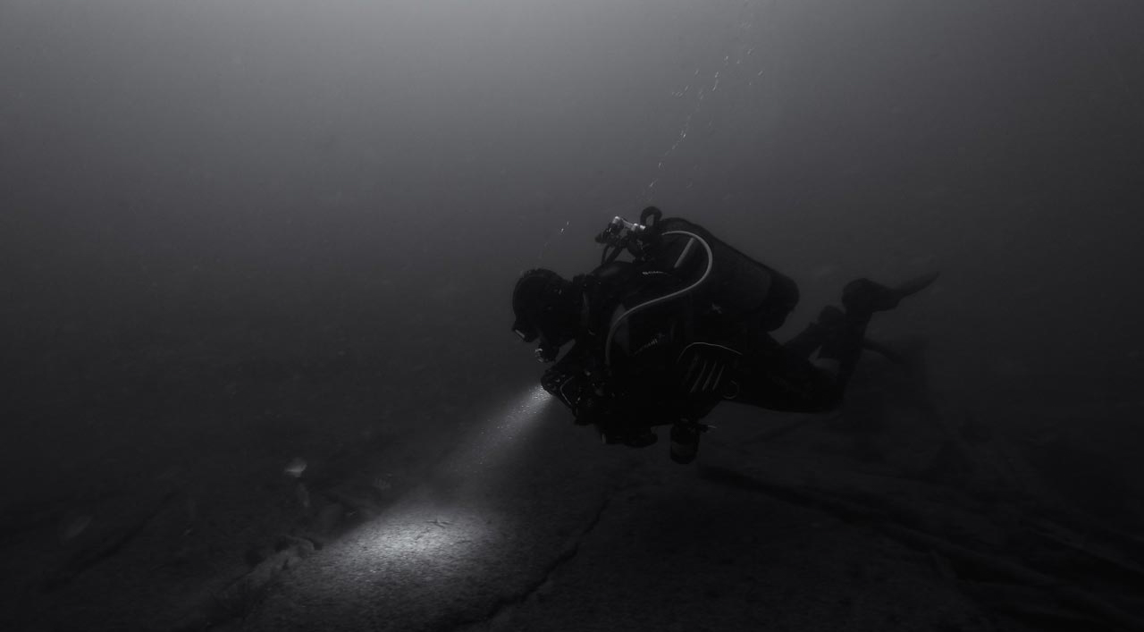 Scuba diver exploring the Recoin wreck off the coast of Oleron Island in France.
