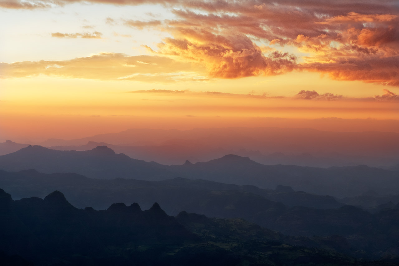Sunrise over the Simien Mountains in Ethiopia. Photograph in color by Amar Guillen, artist photographer.