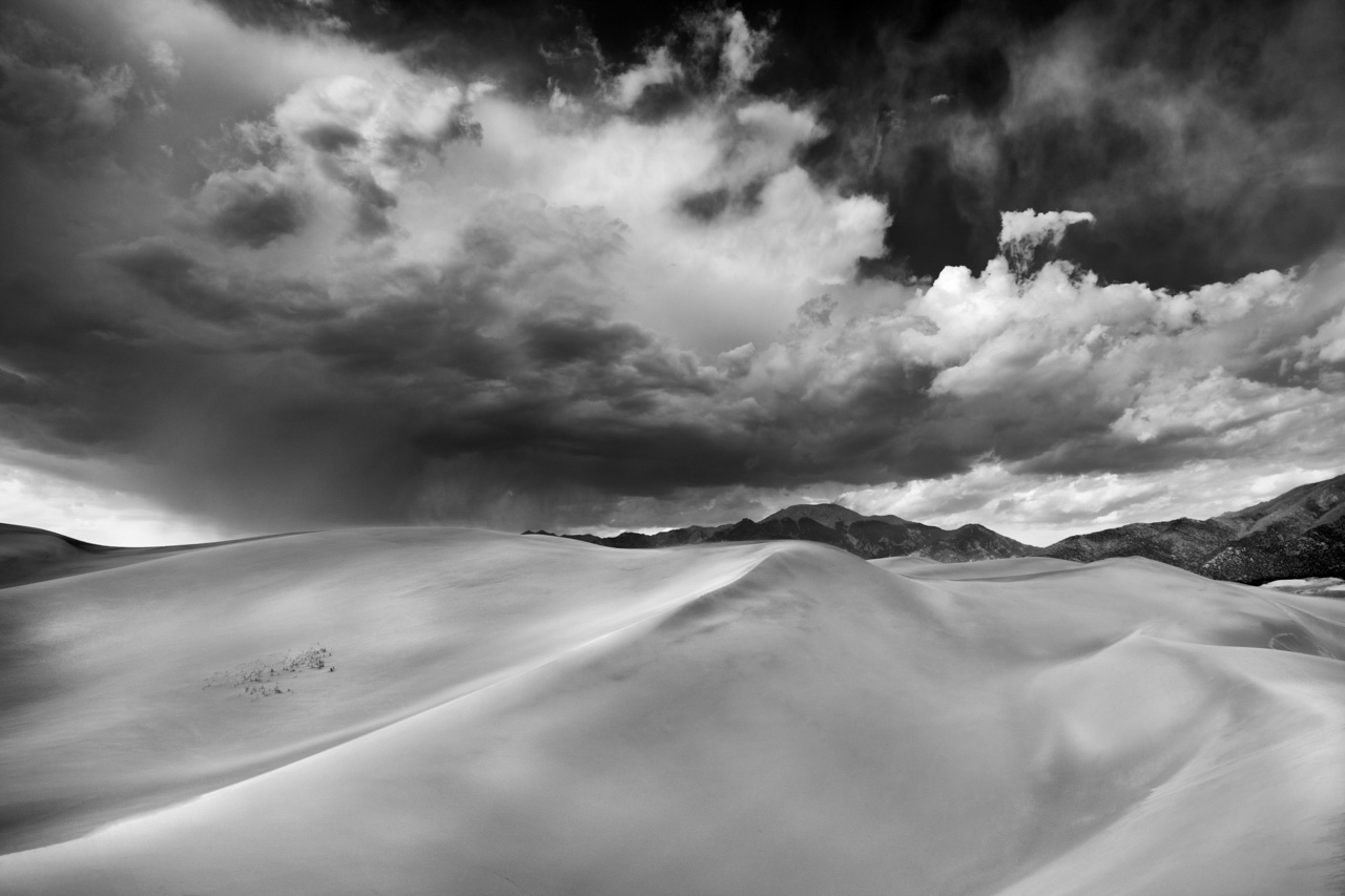 Storm on Great Sand Dunes national park in Colorado in US. Black and White photo by Amar Guillen.