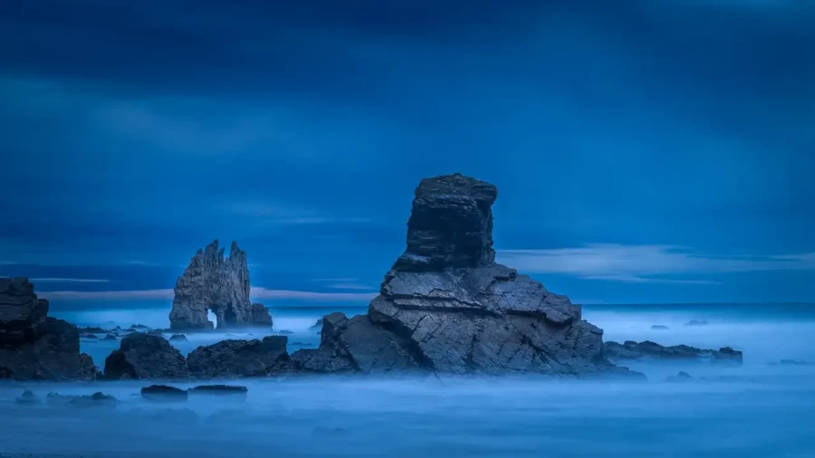 Seascape of the Asturias in Spain. The waves are breaking on the cliffs or the rocks of the coast.