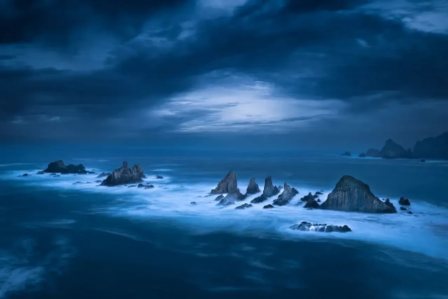 Seascape of the Asturias in Spain. The waves are breaking on the cliffs or the rocks of the coast.