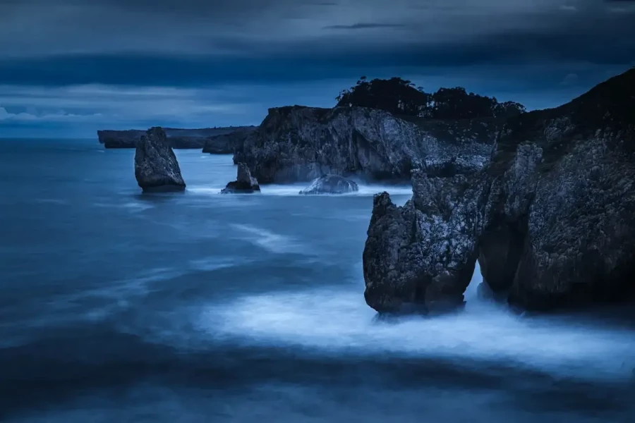 Seascape of the Asturias in Spain. The waves are breaking on the cliffs or the rocks of the coast.