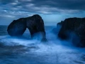 Seascape of the Asturias in Spain. The waves are breaking on the cliffs or the rocks of the coast.