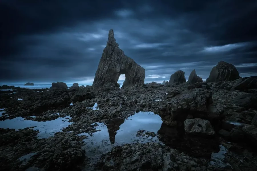 Seascape of the Asturias in Spain. The waves are breaking on the cliffs or the rocks of the coast.