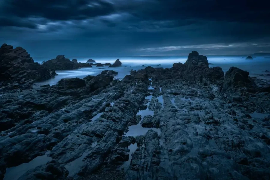 Seascape of the Asturias in Spain. The waves are breaking on the cliffs or the rocks of the coast.