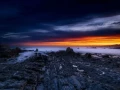 Seascape of the Asturias in Spain. The waves are breaking on the cliffs or the rocks of the coast.