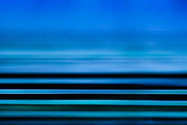 Abstract photo of waves on the surface of the water. The horizontal lines give the photo a sense of tranquility. They are soothing.