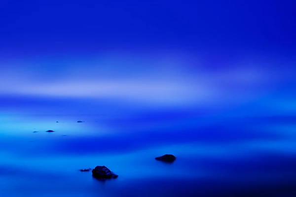 Sets of lights at the surface of Lake Yellowstone. Photograph by Amar Guillen, photographer artist.