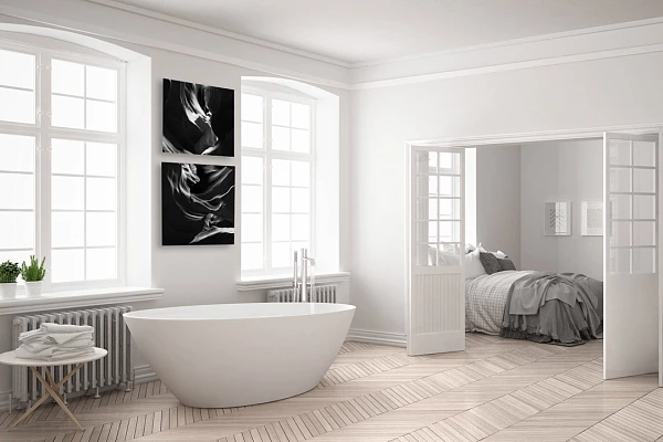 22 fine art prints of Antelope Canyon in black and white displayed in a bathroom.